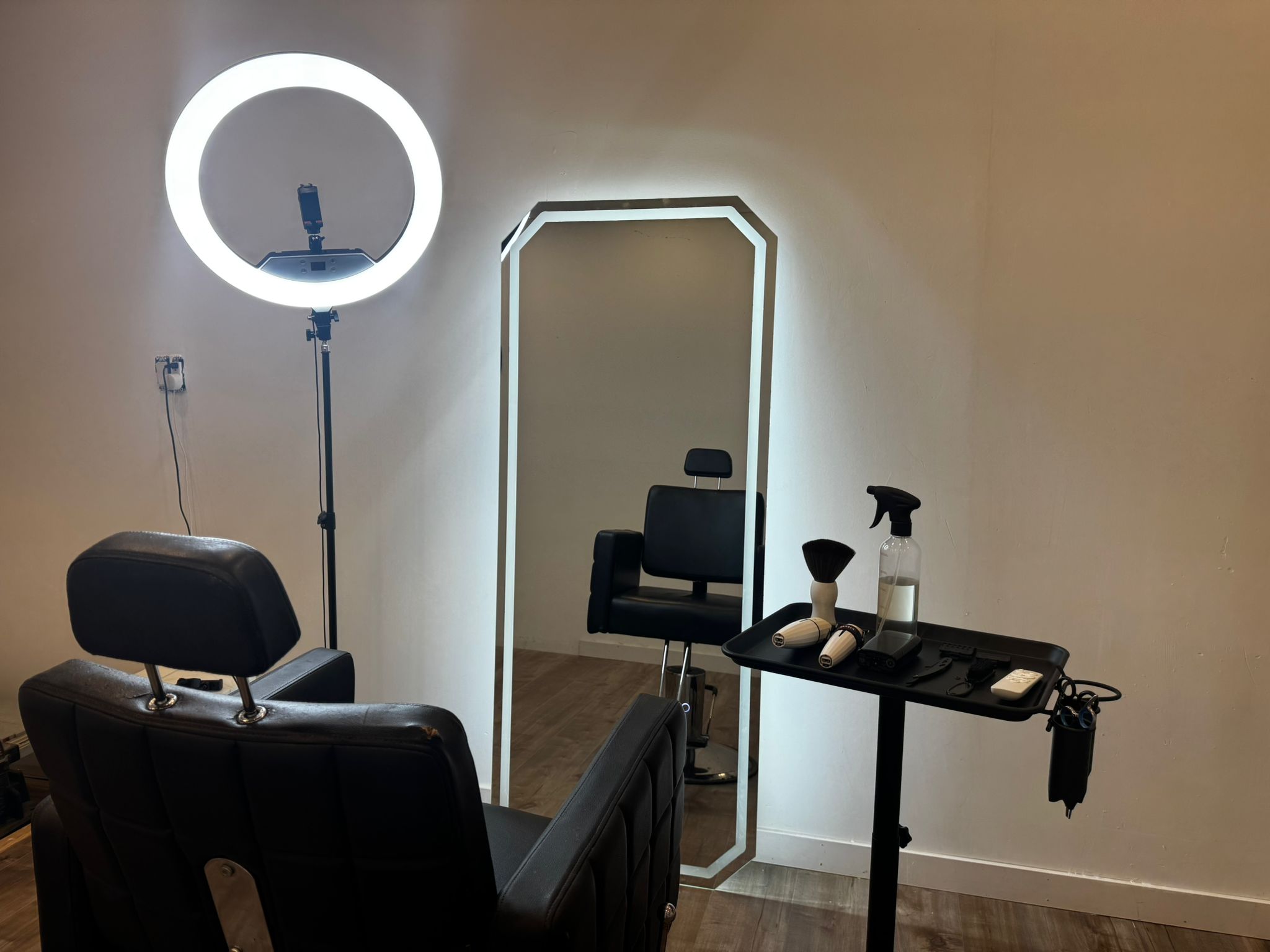 The Shear Studio chair beneath the glowing ring light
